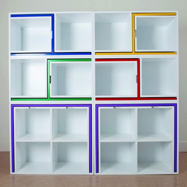 A Bookcase That Cleverly Stores Chairs and Tables
