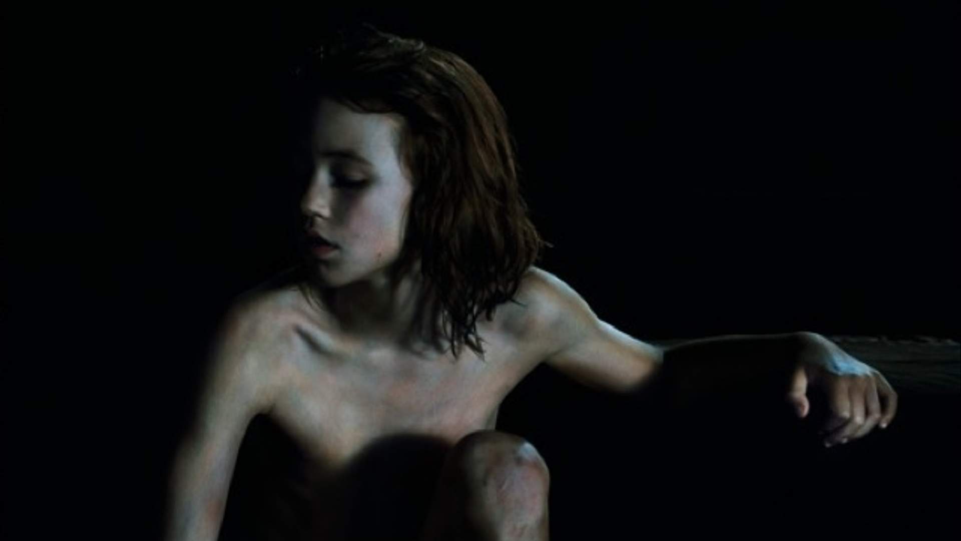 A close-up of Bill Henson's work- revealing intricate details and shadows.