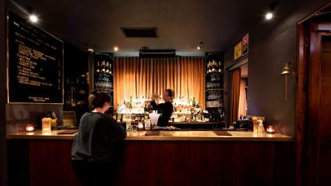 Person ordering at the bar at Golden Age Cinema Surry Hills