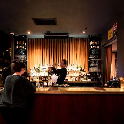 Person ordering at the bar at Golden Age Cinema Surry Hills