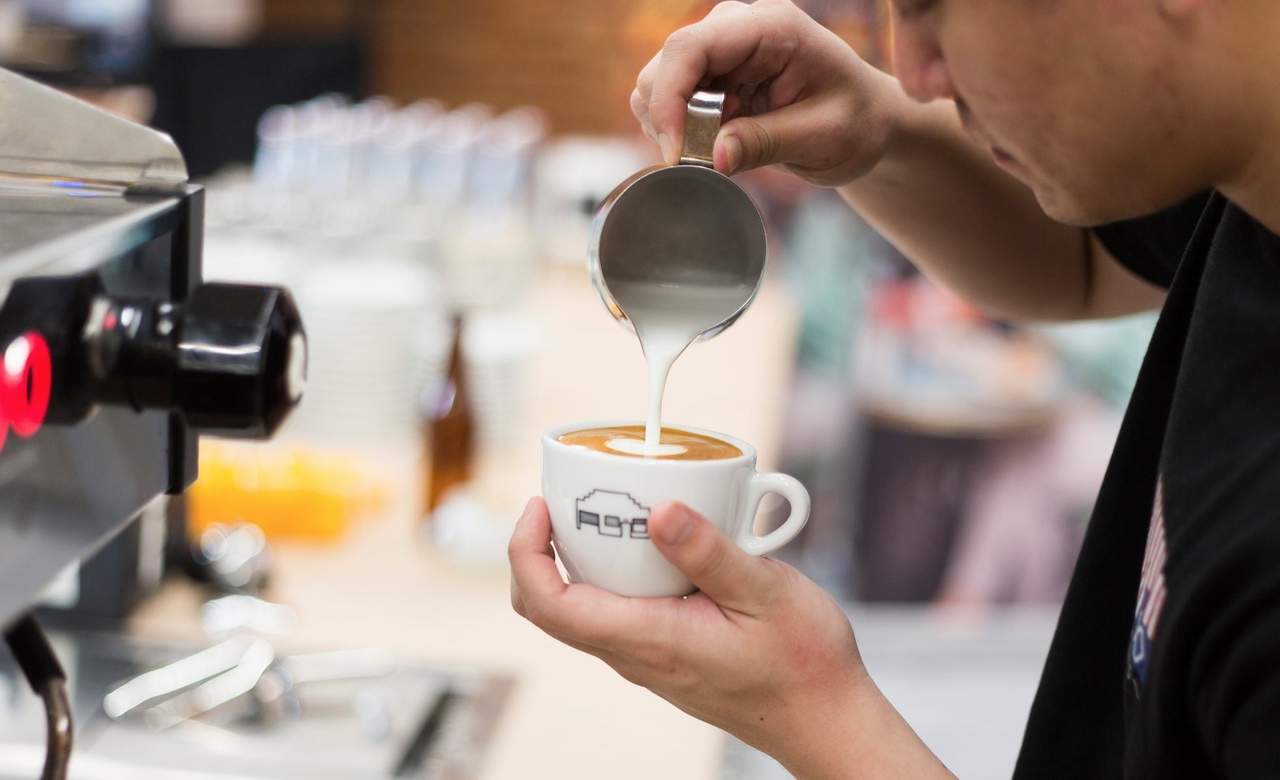 barista pouring coffee at St Ali in South Melbourne.