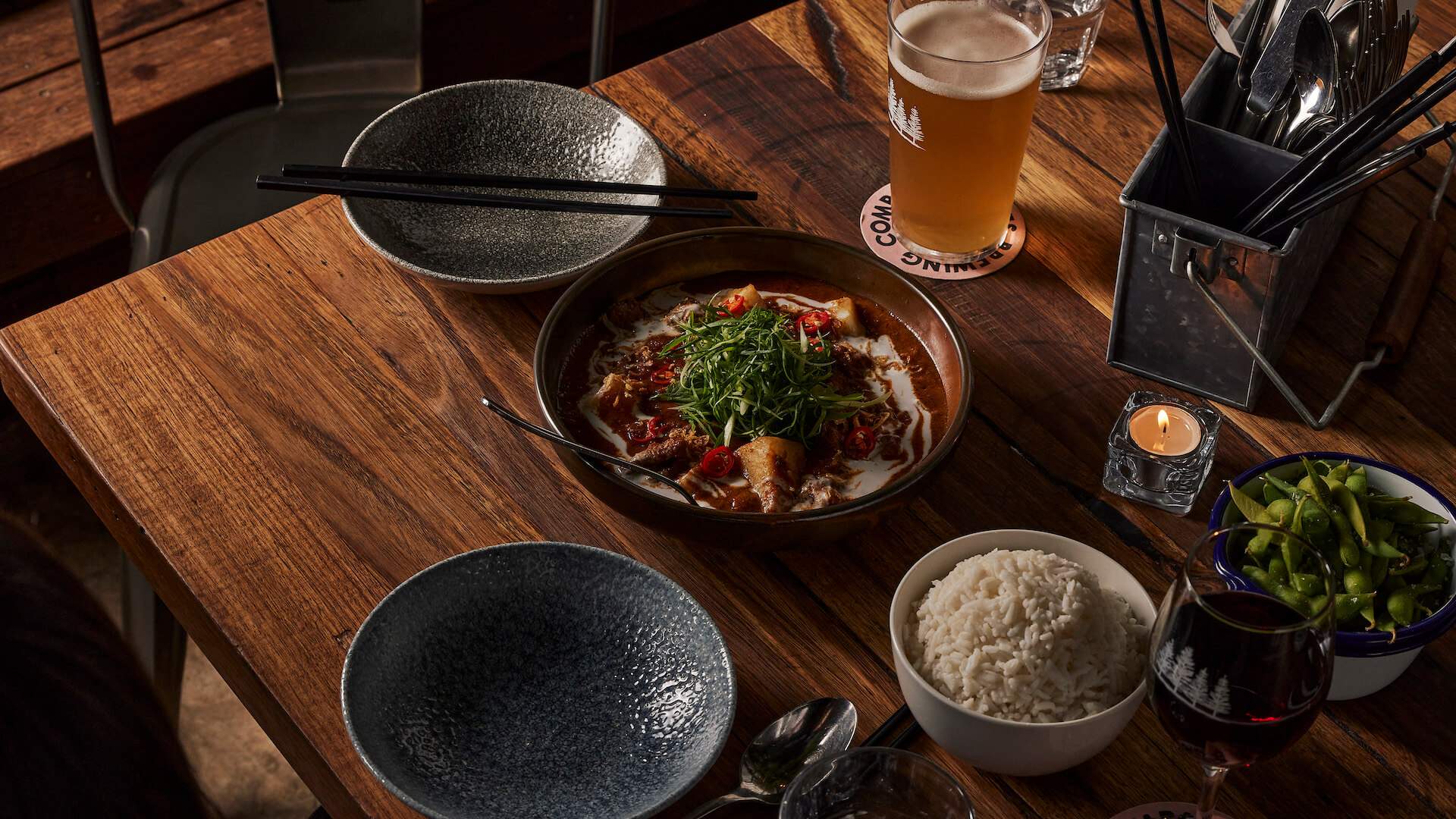 A table with curry, rice and edamame beans — The Hall at Welcome to Brunswick