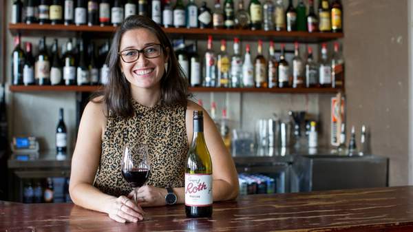 Dani Elred, owner of Roth's Wine Bar, Mudgee with a glass of Grapes of Roth Shiraz