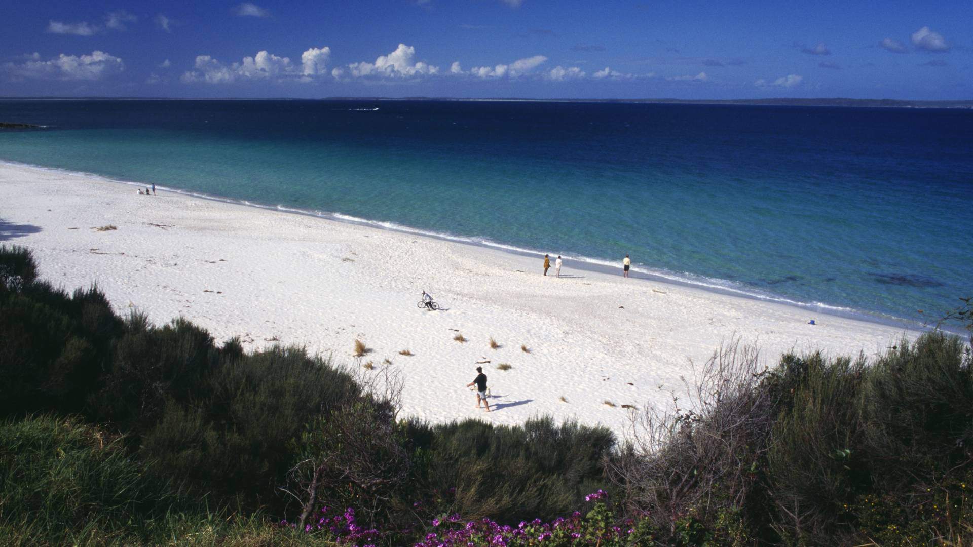 People walking on Hyams Beach Jervis Bay