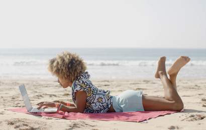 Background image for Five Easy Hacks to Turn Your Work Desk Into a Permanent Holiday