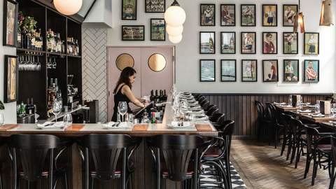 bartender working at Porteno - sydney - home to some of the best steaks in sydney - argentine grill