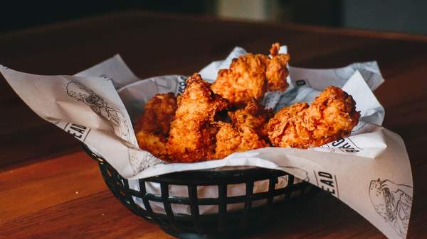 a basket full of fried chicken at burger head - one of the best burger joints in Sydney