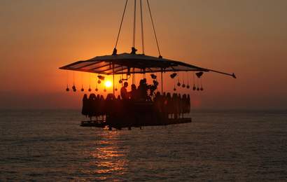 Background image for Acclaimed Chef Massimo Bottura Just Hosted a Dangling Dinner in the Sky