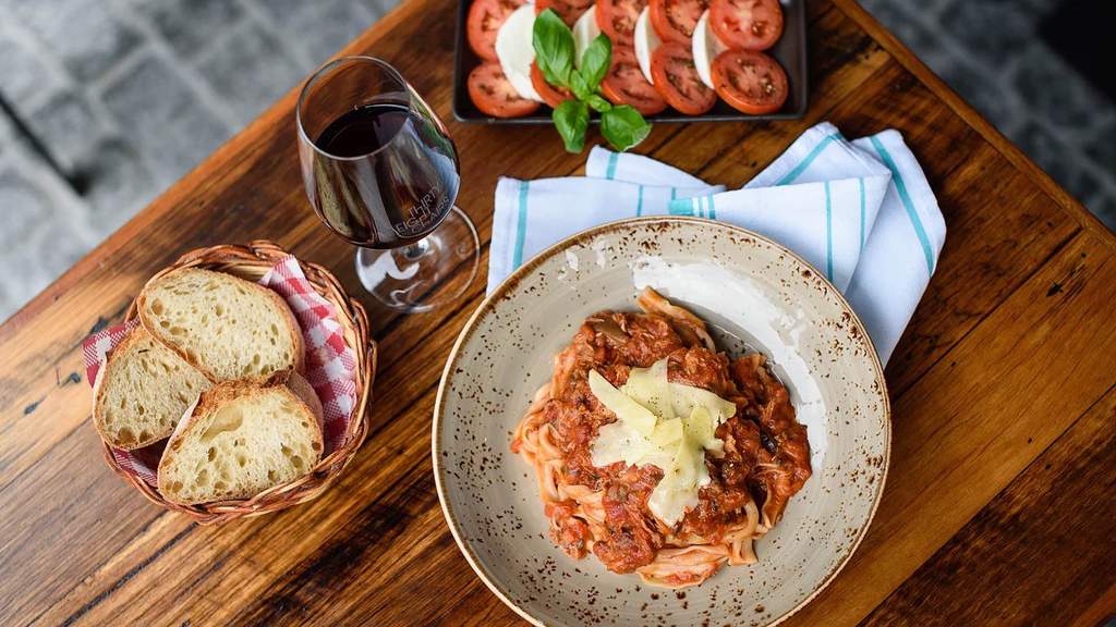duck ragu and a glass of wine at Thirty Eight Chairs - where you will find some of the best pasta in Melbourne