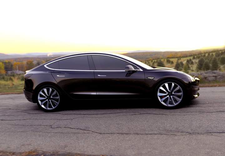 Background image for Tesla Has Just Started Production on Its First Mass-Market Electric Car