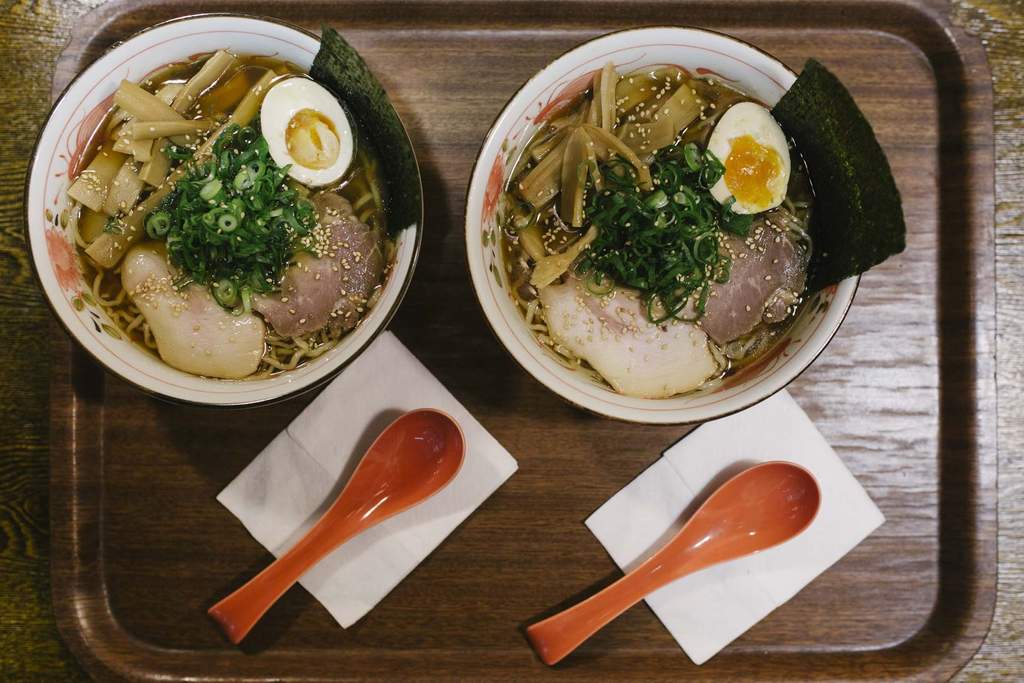 Two bowls of ramen served at a table in Taro's Ramen restaurant, located in Brisbane City.