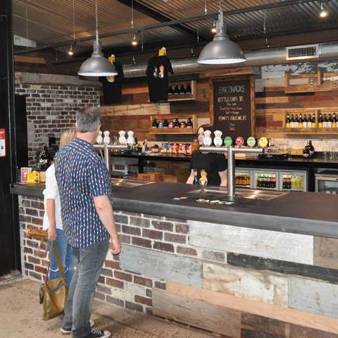 People ordering at the bar at Sauce Brewing Co in Marrickville, Sydney - one of the best sydney brewery bars