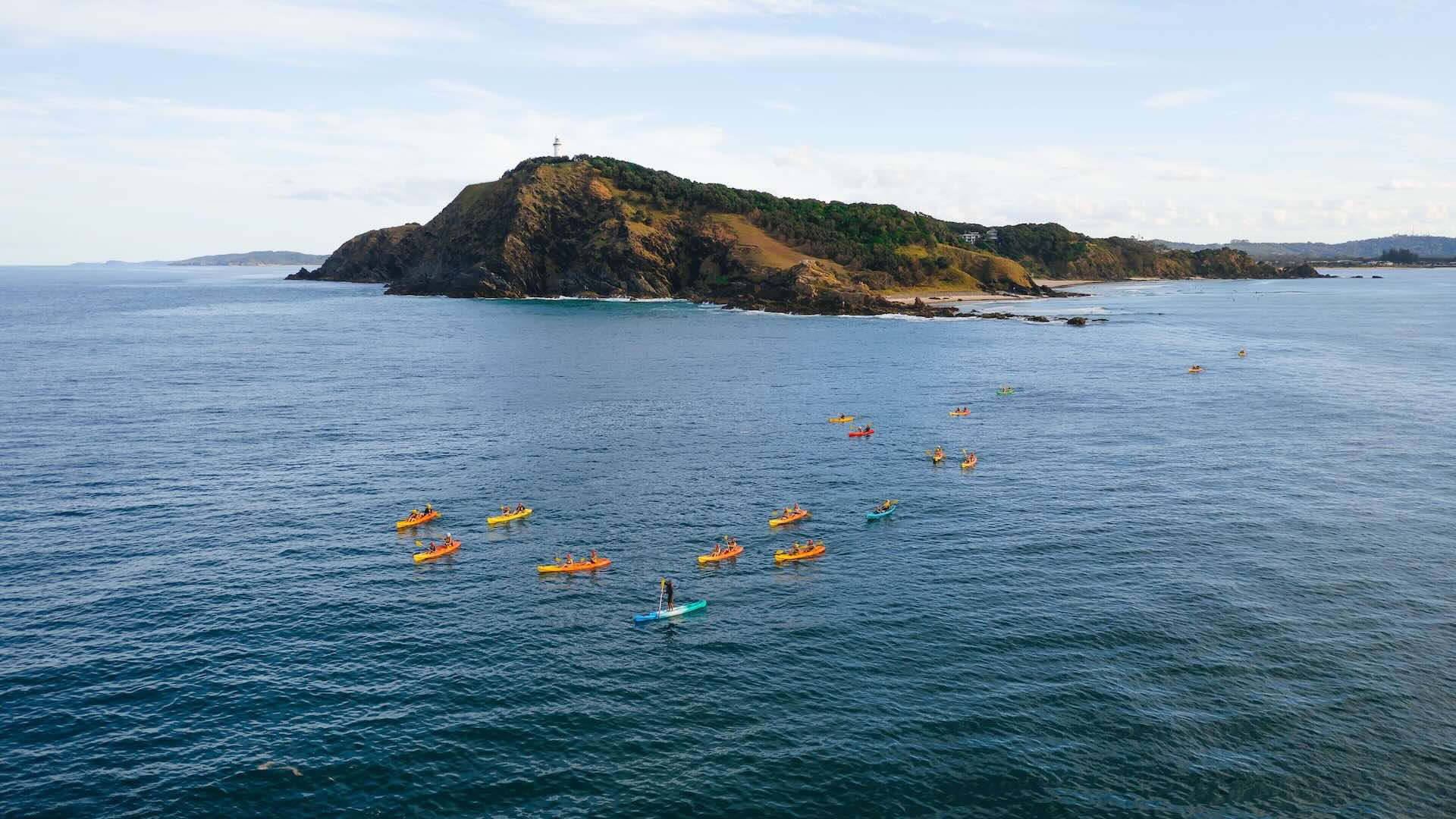 Experience all the fun and adventure of a Cape Byron Kayaks guided tour in Cape Byron Marine Park. Feel the exhilaration as you paddle your kayak with the dolphins, turtles, and whales that frequent the enticing waters of Byron Bay. Whether you are a novice or an experienced kayaker your adventure will include paddling the magnificent protected bay, surfing the waves, encountering abundant marine life, relaxing and enjoying all the Tim Tams you can eat once back at the beach.
