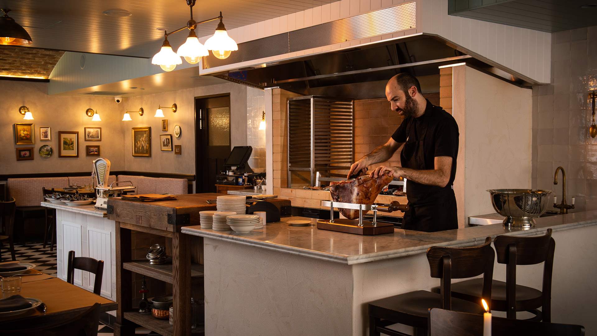 chef shaving a leg of ham at Bistecca - one of the best steak restaurants in sydney