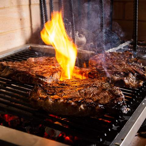 steaks cooking at Bistecca - one of the best steaks in Sydney