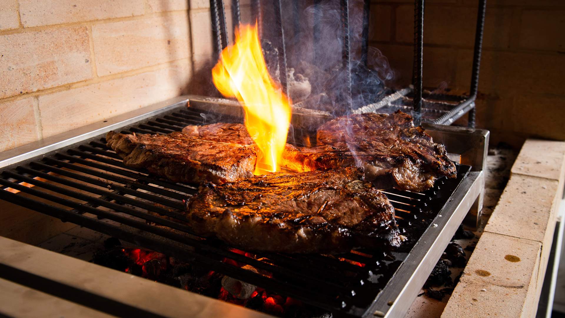 steaks cooking at Bistecca - one of the best steaks in Sydney