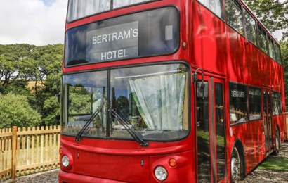 Background image for You Can Now Stay In an Agatha Christie-Inspired Hotel Inside a Double Decker Bus