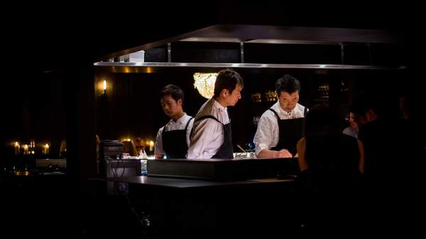 Three chefs working in the kitchen at Honto - one of the best Japanese restaurants in Brisbane.