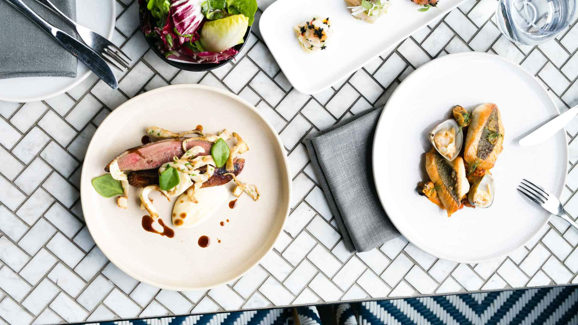 A selection of dishes on the table at The Atlantic in Melbourne