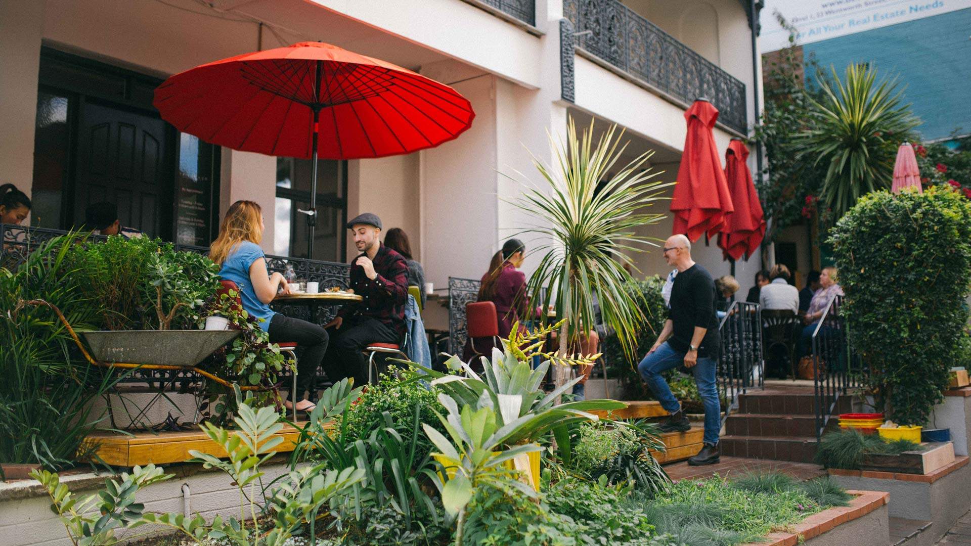 People dining outside under umbrellas at Circa Espresso - - one of the best cafes in Sydney