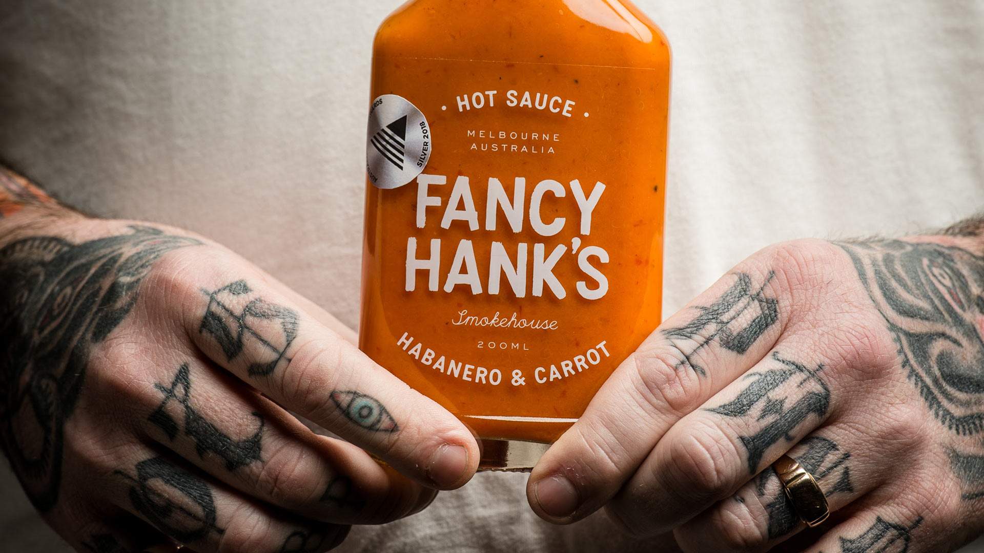 Barbecue Legend Fancy Hank's Has Just Dropped a Line of Take-Home Hot Sauces