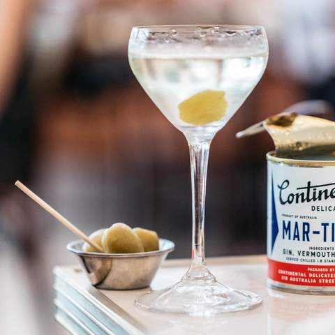 a martini with olives poured from a can - best bars in Sydney - continental deli newtown