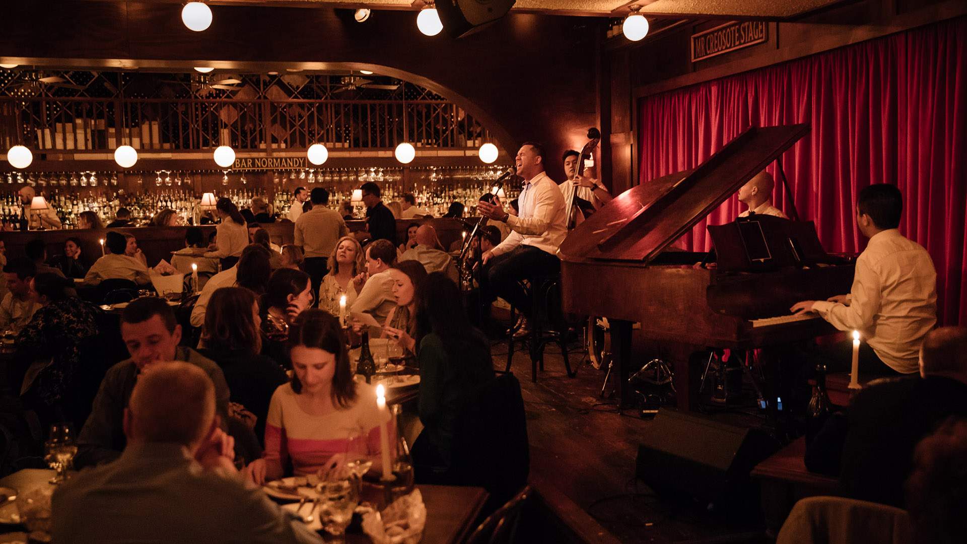 A musician playing jazz music in the dining bar at Restaurant Hubert - home to one of the best steaks in Sydney. Also one of the best restaurants in Sydney.