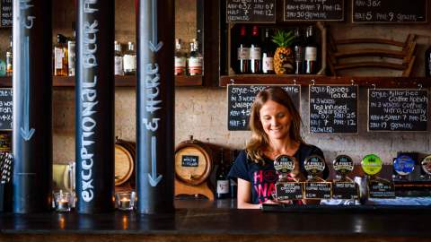 person pouring beers at 4 Pines Brewpub - one of the best Sydney brewery - manly