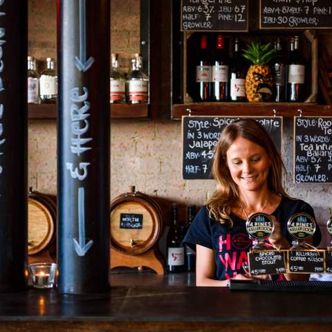 person pouring beers at 4 Pines Brewpub - one of the best Sydney brewery - manly