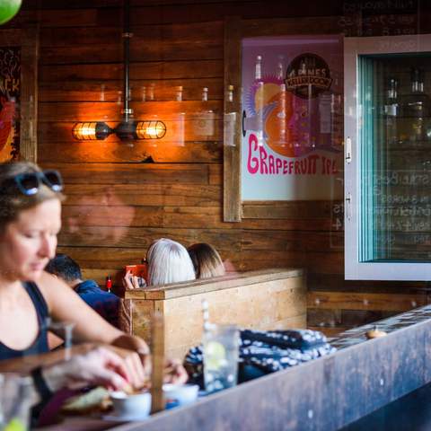 person pouring beers at 4 Pines Brewpub - Sydney brewery - manly