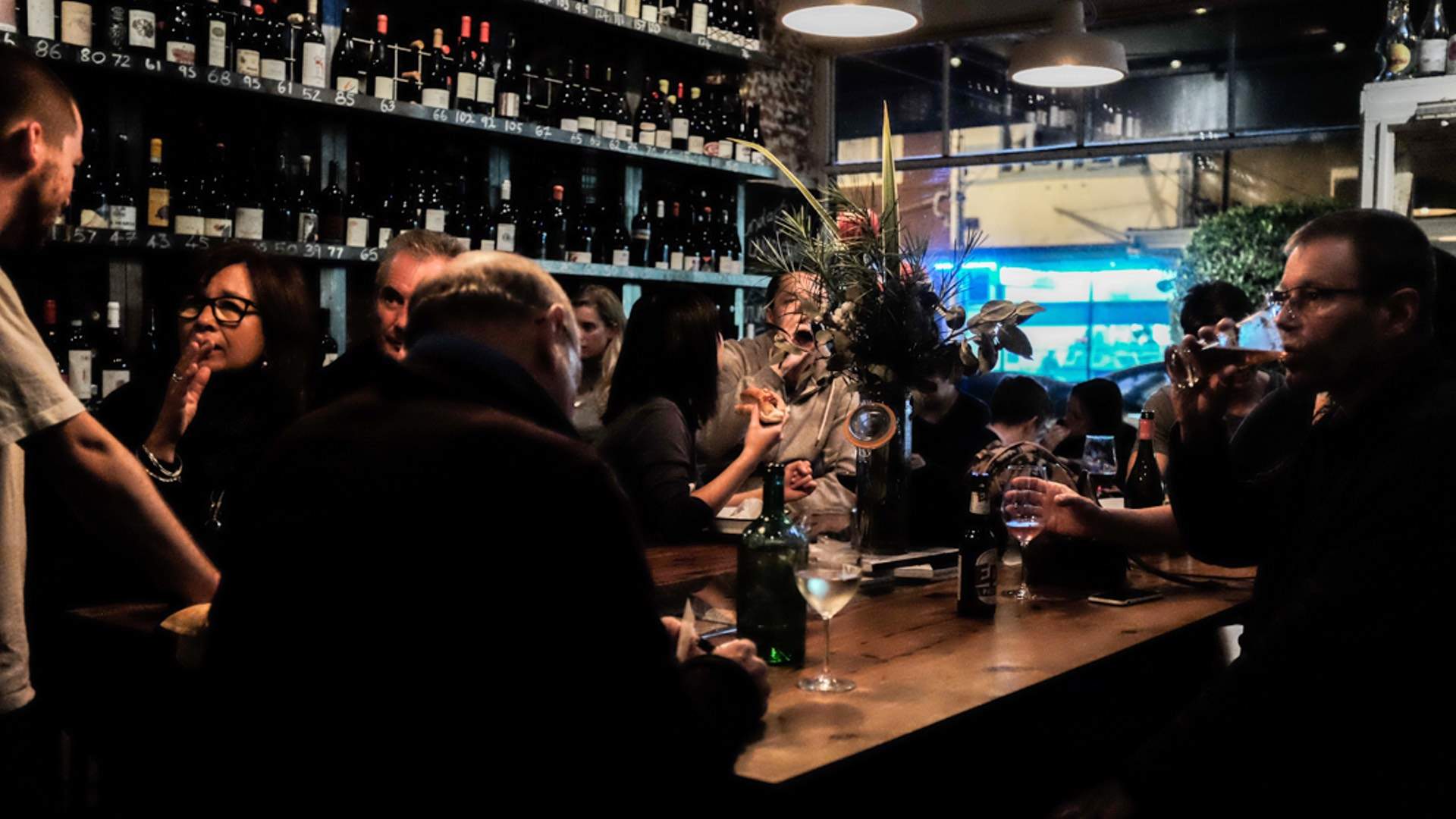 a busy bar full of people drinking - milton wine shop - one of the best wine bars in Melbourne