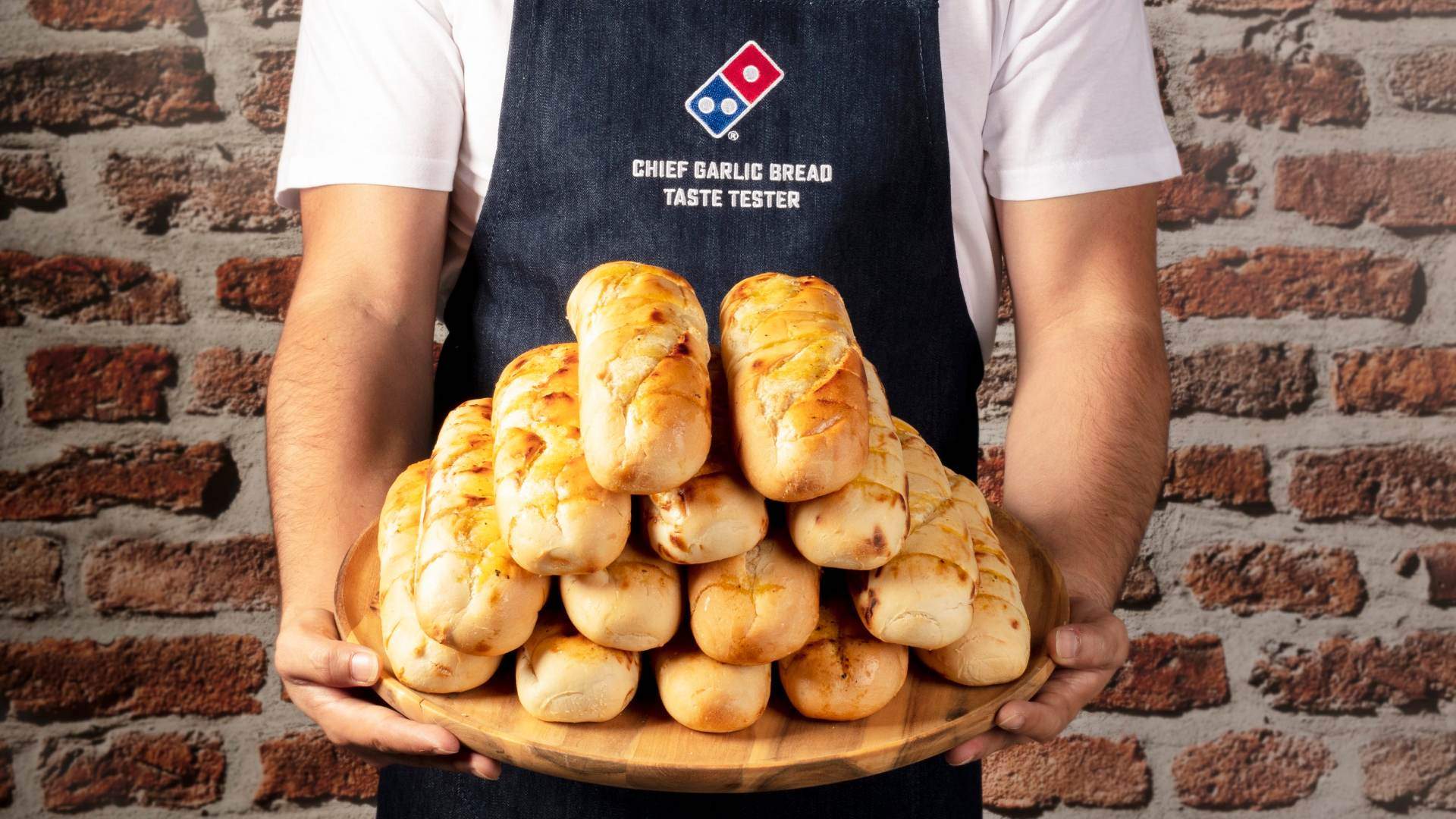Domino's Wants to Pay You $30 an Hour to Eat Garlic Bread