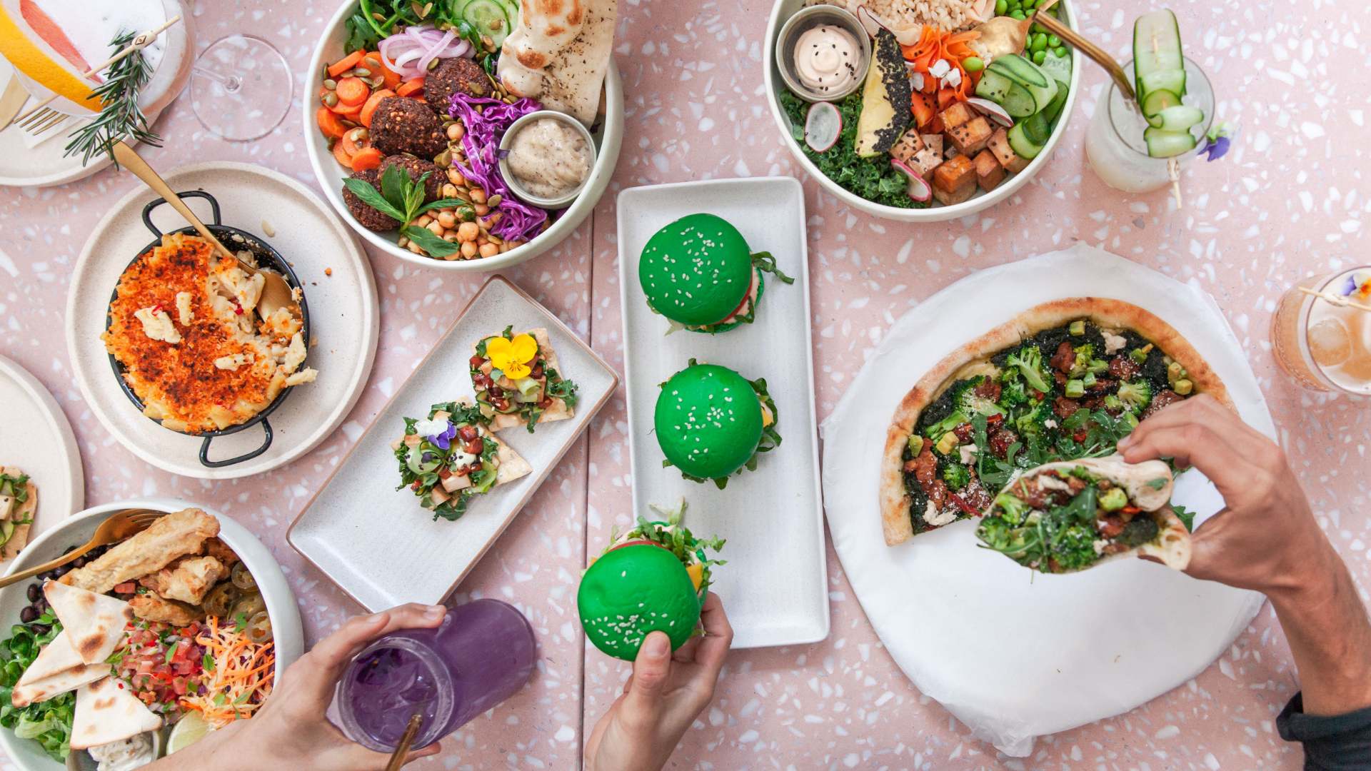 a selection of vegan eats at Sydney's Eden Bondi. Vegan pizza, burgers and tacos