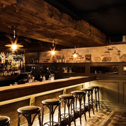 an empty bar with stools at The Cumberland - one of the best bars in Sydney