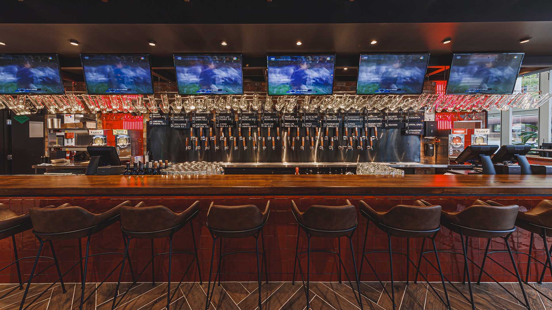 an empty bar with televisions at Winghaus - one of the best sports bars in Brisbane