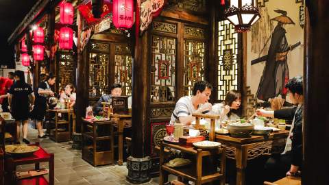 a group of people eating at Panda Hot Pot - one of the best hot pot spots in Melbourne