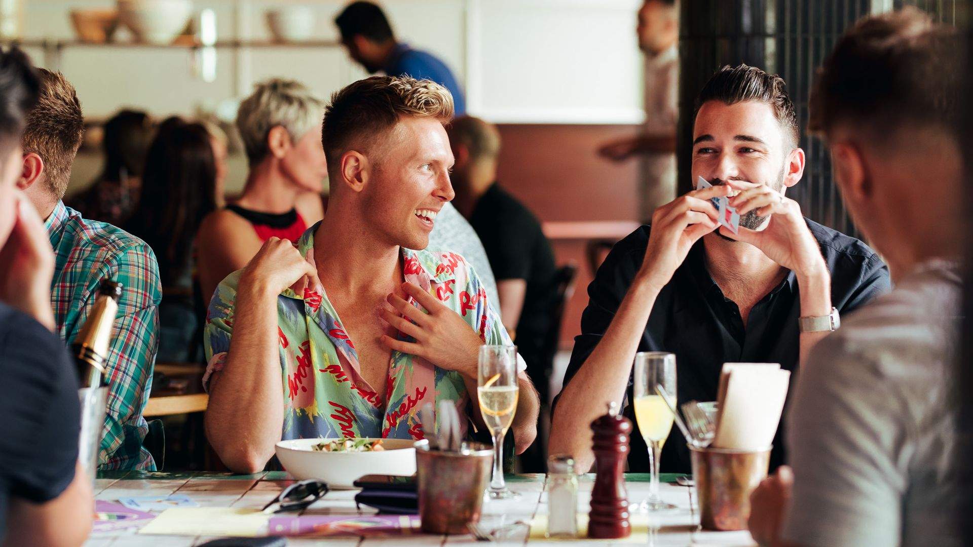 Two men having a drink and food at the Beresford