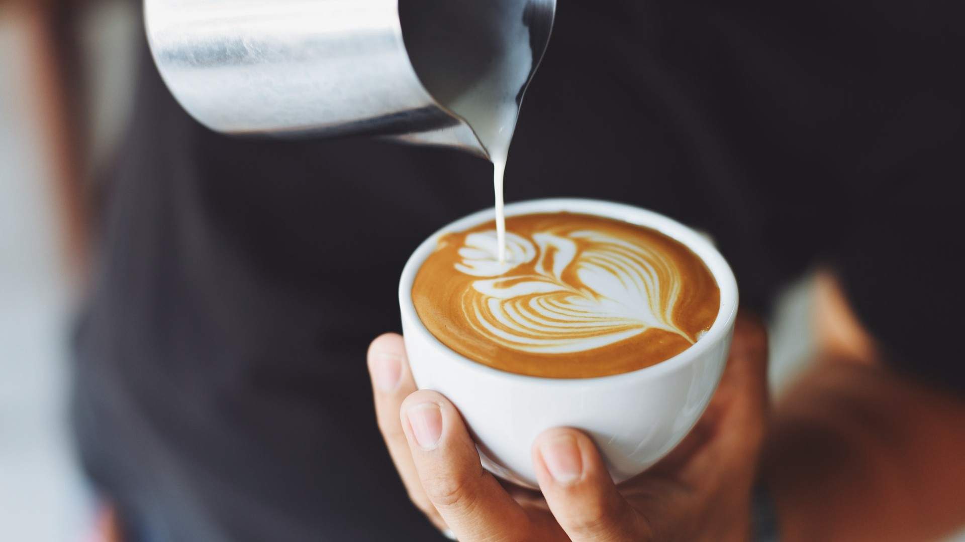 milk pouring into cappuccino