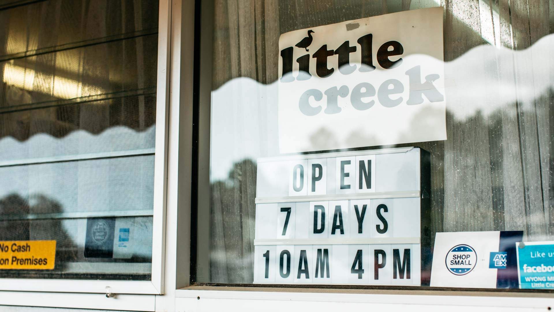 Signage at Little Cheese Creek, Central Coast, saying "open 7 days 10am 4pm"