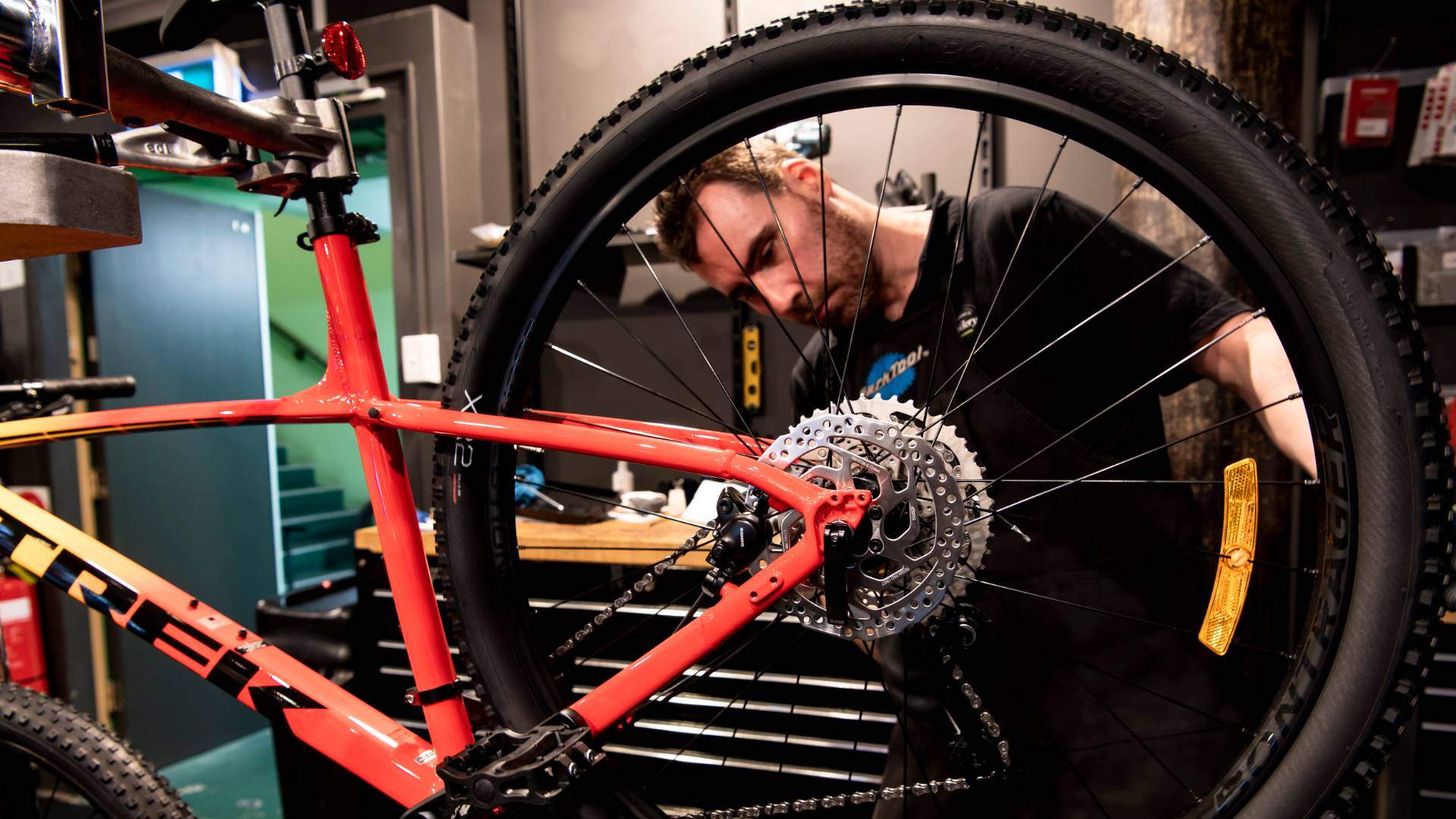 Person fixing a bike at bike store Sydney