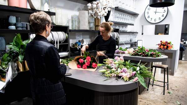 Florist and customer at Flowers on Norton St