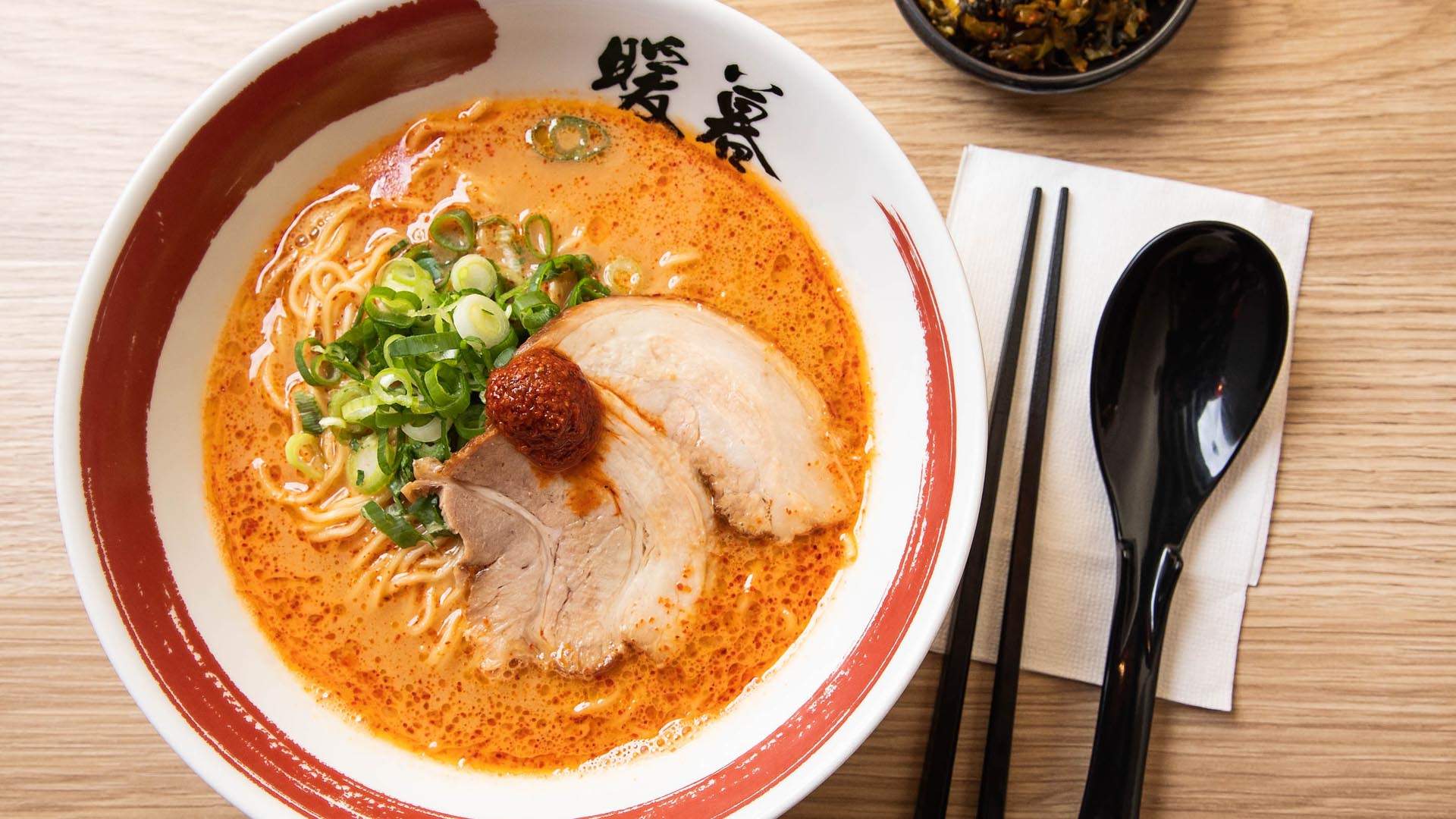 Close up shot of a Japanese dish served in a bowl with chopsticks and a soup spoon placed next to it at Ramen Danbo Sunnybank Hills.