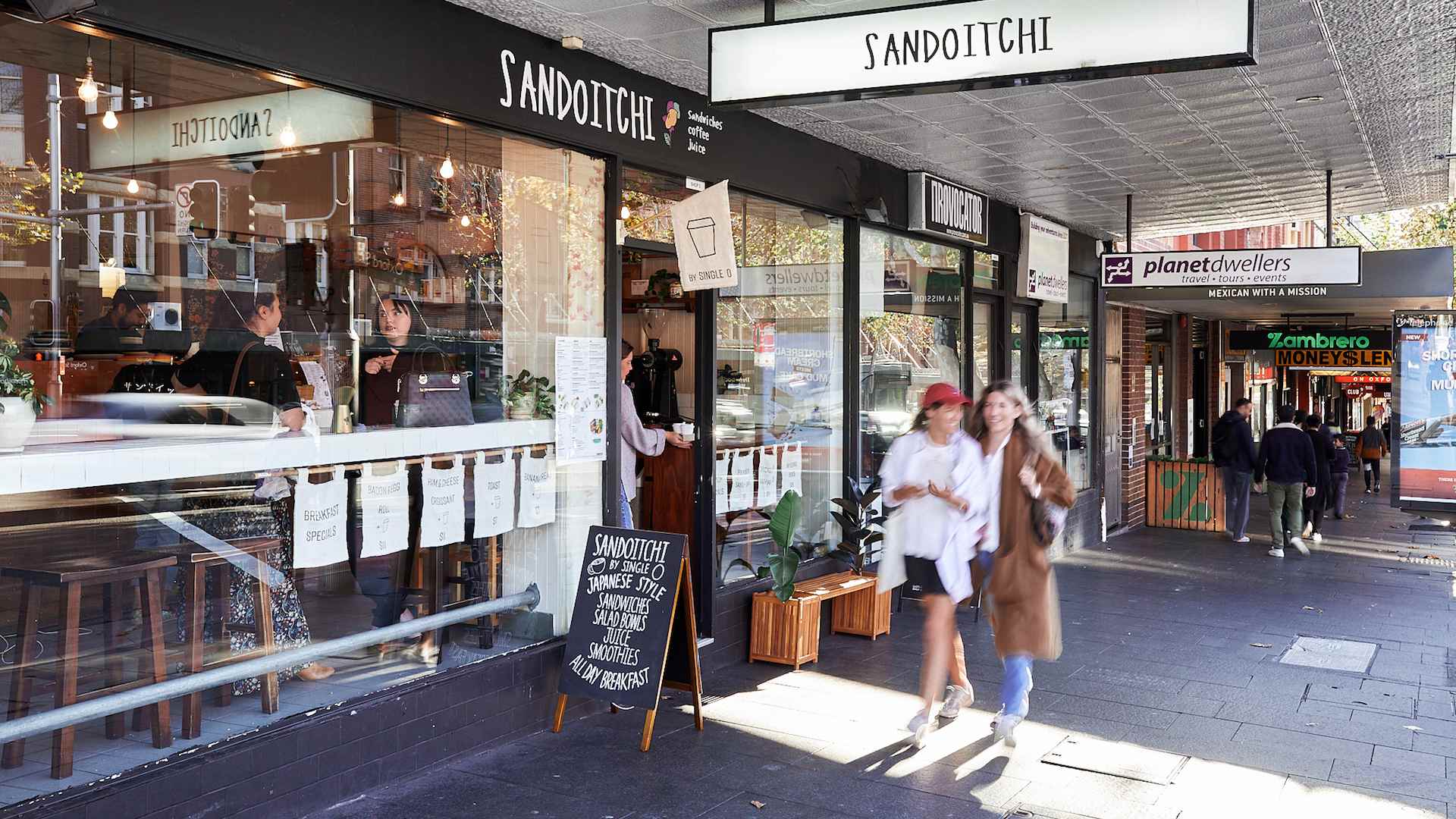 people walking past the front of Sandoitchi - the best cafe in Sydney