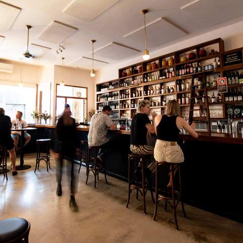 people sitting at the bar at The Sunshine Inn - — one of the best vegan restaurants in Sydney