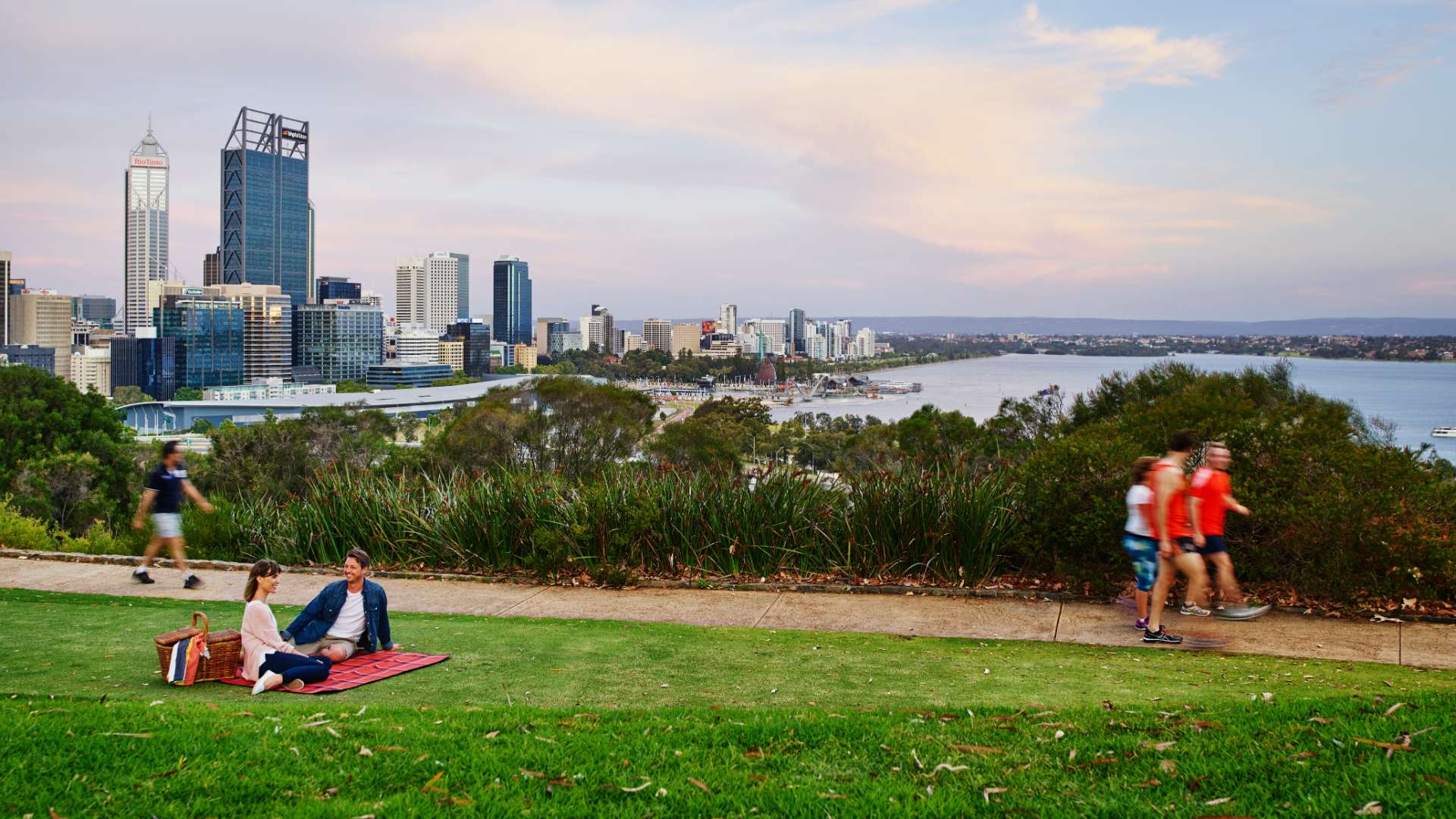 People walking and sitting for a picnic at Kings Park, Perth