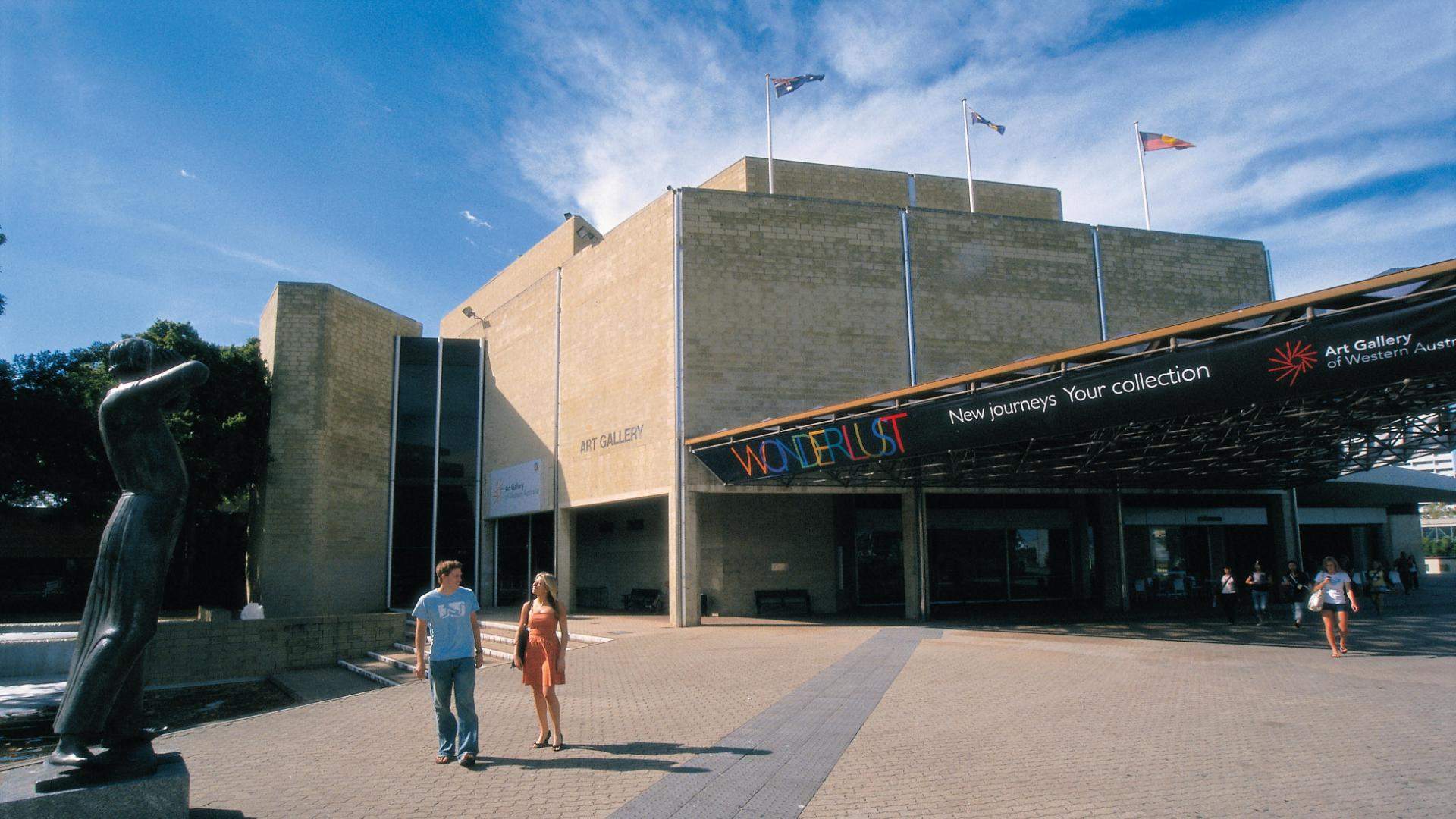 Two people walking outside the Art Gallery of Western Australia