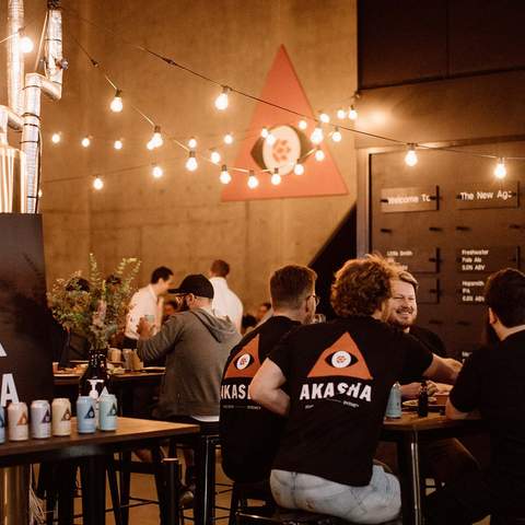 People drinking at Akasha Brewery.