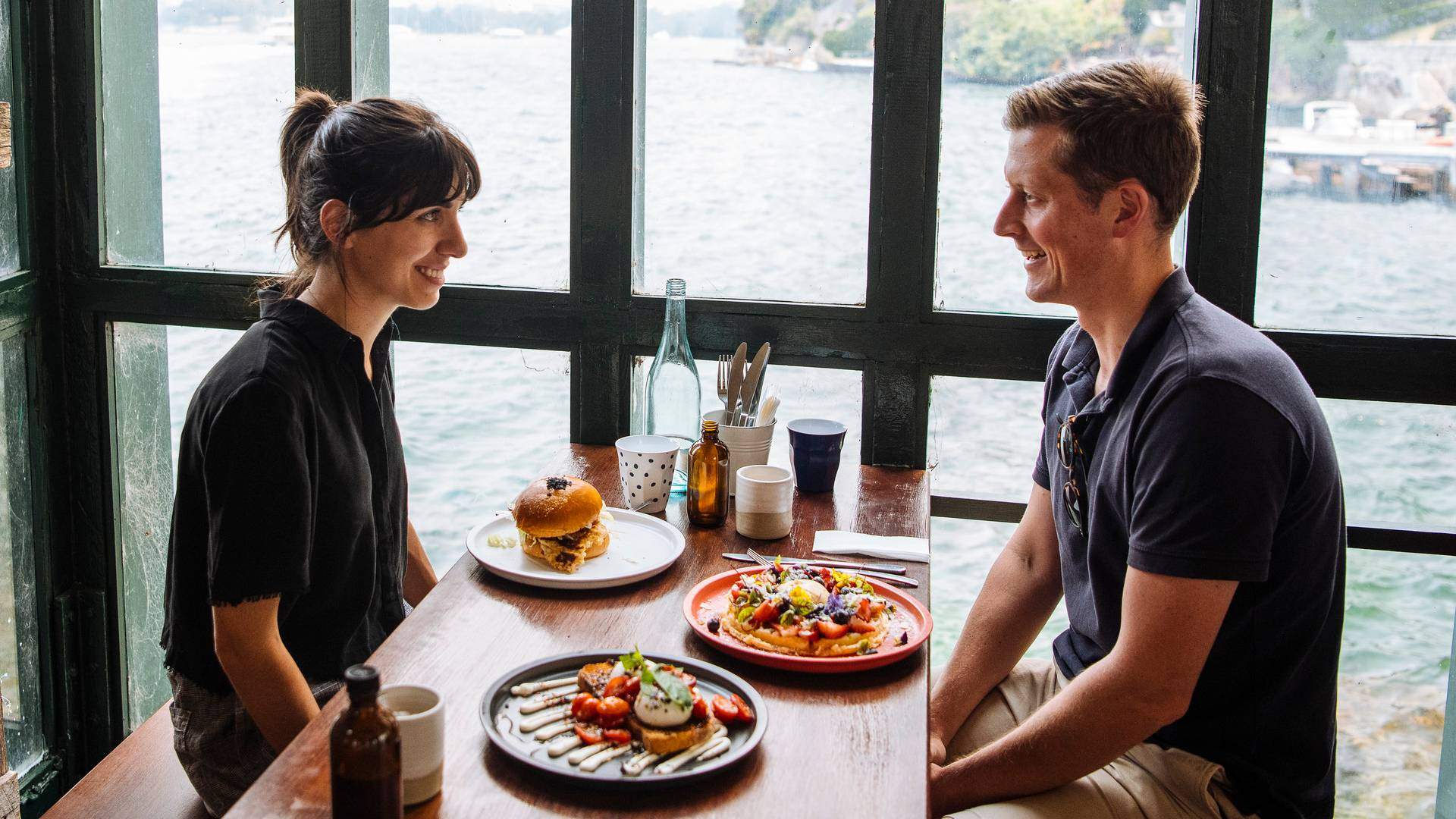 Couple enjoying food and drink at Celsius Coffee Co., Kirribilli
