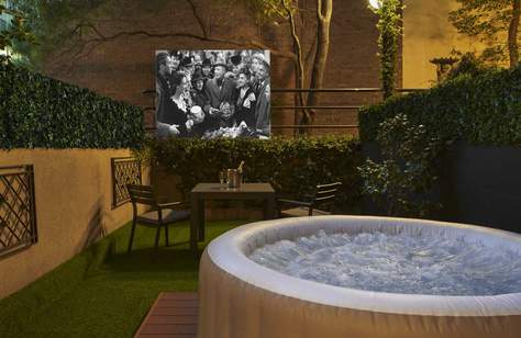 This Melbourne Hotel Has Added a Hot Tub and Outdoor Cinema in a Private Courtyard to Your Next Staycation