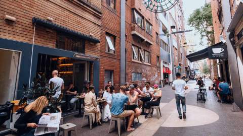 Patrons enjoying breakfast at laneway cafe Room 10 in Potts Point.